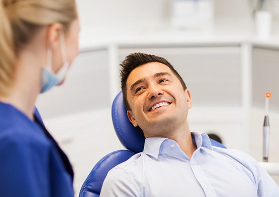 Man smiling at the dentist